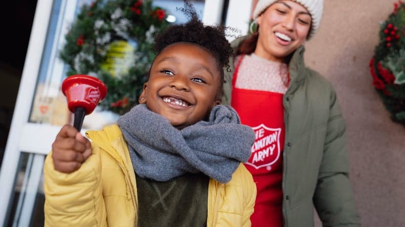 Salvation Army Officer talking and smiling with a community member.